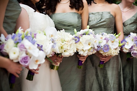 The bridesmaids carried fluffy hydrangea, phaleonopsis orchids, lavender scabiosa, and more.